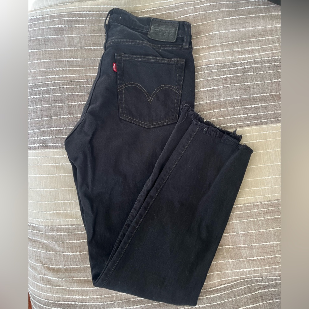 Levi’s distressed black denim jeans